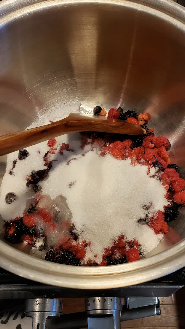Then put the berries in the pot with the sugar and the juice from your lemon.