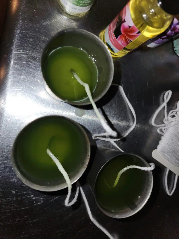 Once everything is melted, turn off the heat, add your fragrance, and pour into your candle molds! Make sure your wicks are centered!