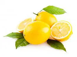 Whole and halved lemons with leaves