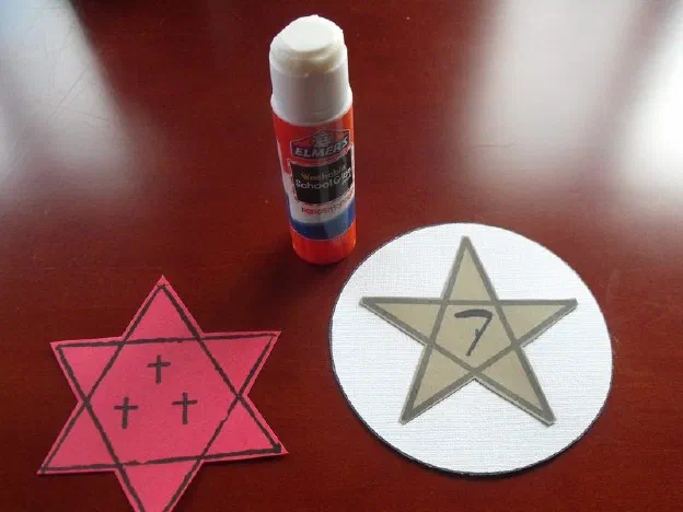 In the center of the six-pointed star I've chosen symbols for deity. In this case, the triple crucifix for Father, Son, and Holy Spirit.